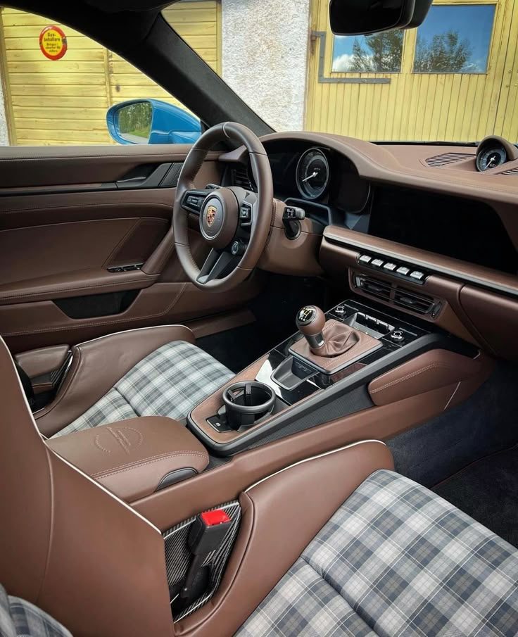 Porsche 911 interior after full detail — pristine brown leather