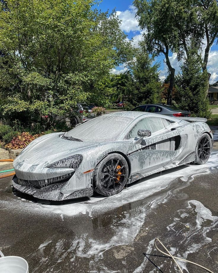 McLaren supercar receiving a premium foam wash and ceramic coating