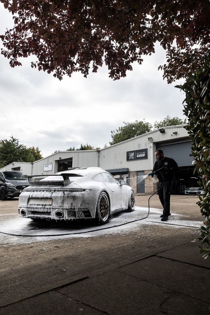 Exterior foam bath — snow foam pre-wash on a Porsche 911